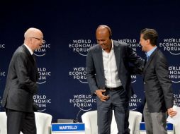 El fundador del WEF, Klaus Schwab, y los presidentes Michel Joseph Martelly, de Haití y Enrique Peña Nieto, de México. AFP / E. Ruiz