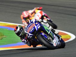 Lorenzo cruzó la meta por delante de Márquez y Pedrosa. AFP / J. Soriano