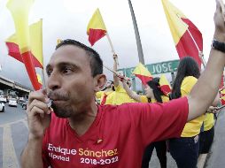 Simpatizantes del Partido Acción Ciudadana ondean sus banderas este sábado, de cara a las elecciones presidenciales y de diputados. EFE/J. Arguedas