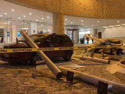 Automóviles dañados afuera de un hotel luego de los derrumbes ocasionados por el sismo de magnitud 7.1 con epicentro cercano al puerto de Aacapulco. AFP / F. Robles