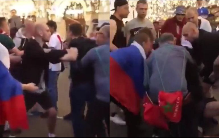 Dos aficionados, aparentemente rusos, se encontraban en el suelo enganchados en una pelea, mientras distintas personas trataban de separarlos. ESPECIAL