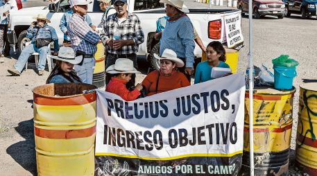 Productores de maíz amenazan con bloquear de nuevo carreteras, en protesta por la caída de precios y el incumplimiento de apoyos. Amagan con afectar eventos del Mundial de Futbol. EL INFORMADOR/ A. Navarro