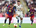 El cuadro blaugrana suma 88 puntos y aventaja por 11 unidades al conjunto merengue. AFP/ ARCHIVO.