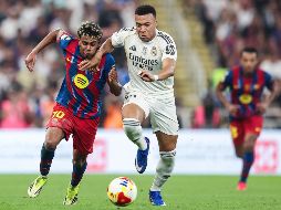 El cuadro blaugrana suma 88 puntos y aventaja por 11 unidades al conjunto merengue. AFP/ ARCHIVO.