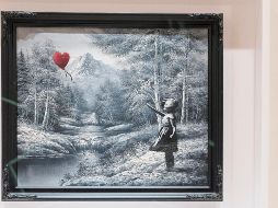 La obra de Banksy fue vendida por 17.9 millones de dólares, en Nueva York. EFE