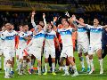 Jugadores de Universidad Católica festejan la victoria sobre Boca Juniors que les dio el primer lugar del grupo D de la Copa Libertadores. AP/G. Garello