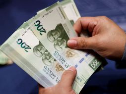 El tipo de cambio tocó un máximo de 17.54 pesos por dólar el 5 de mayo y un mínimo de 17.16 pesos por dólar el 11 de mayo. EFE/ARCHIVO