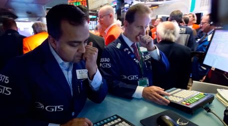 La Bolsa de Nueva York retrocedió después de que la Fed anunciara que no modifica los tipos de interés. AP/ARCHIVO