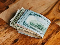 Este miércoles 29 de julio el Banco de México (Banxico) estableció el tipo de cambio FIX en 17.4312 pesos. UNSPLASH / N. DUMLAO