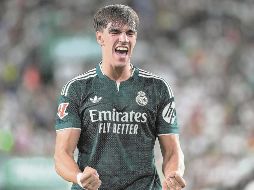 Carlos Espí. El delantero festeja el gol que le da el triunfo al Madrid. AP